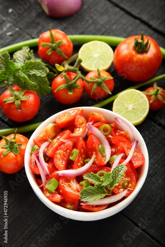 Homemade healthy diet meal, vegan foods background- organic red tomato , onion salad.