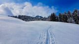 Snow trail in idyllic winter landscape in the Austrian Alps. Vorarlberg, Austria.