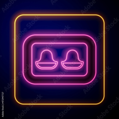 Glowing neon Earplugs with storage box icon isolated on black background. Ear plug sign. Noise symbol. Sleeping quality concept. Vector