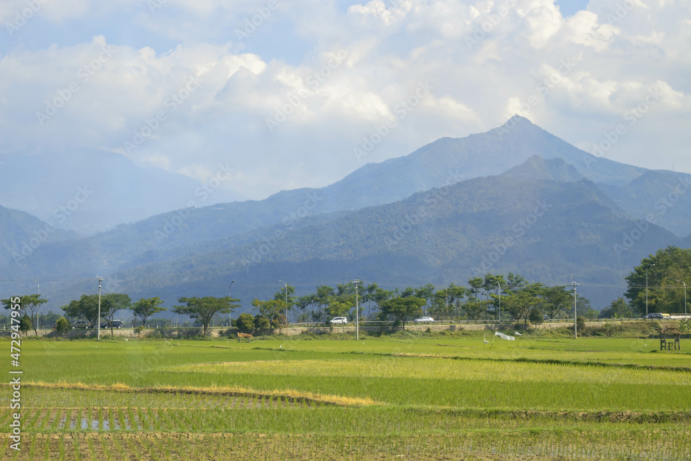 Ambarawa, Indonesia - september 21, 2021: Beautiful country road with mountain background