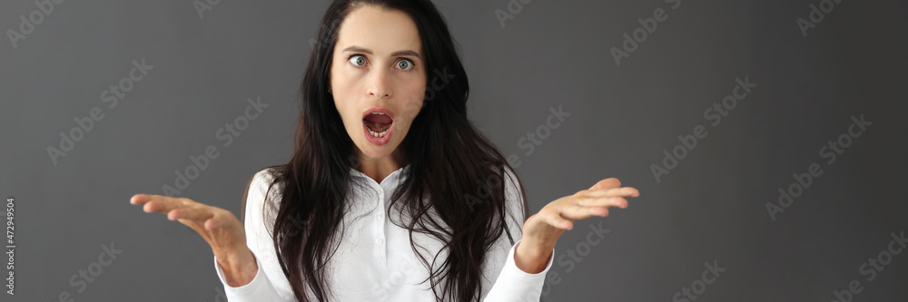 Portrait of young surprised woman with squint - obrazy, fototapety, plakaty 