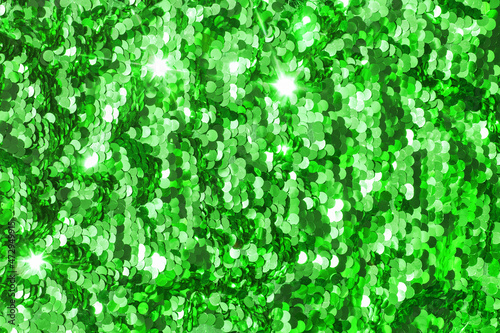 background, strewn with green sequins, glitter sequins green