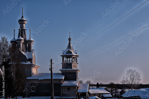 wooden church in the Russian north landscape in winter, architecture historical religion Christianity photo