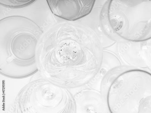 Various empty drink glasses on a white background. Set of empty glasses on white table. Top view