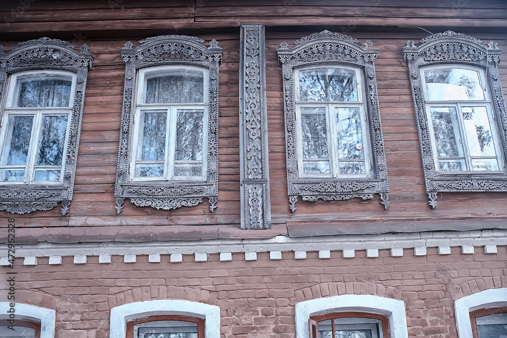 Naklejka premium windows in an old wooden house, russian north architecture design
