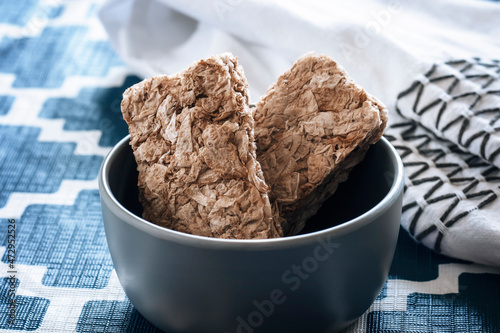 Weet Bix is a whole grain wheat healthy cereal. High protein and healthy breakfast in a bowl created and manufactured in Australia and New Zealand by the Sanitarium Health Food Company photo