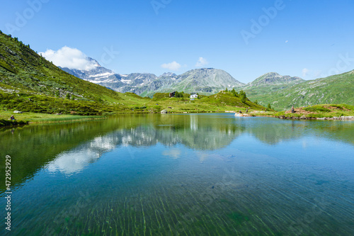 The meadows  glaciers  lakes and mountains of the Simplon Pass  one of the most beautiful areas of Switzerland located in the heart of the Alps - July 2021.