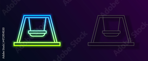 Glowing neon line Swing for kids summer games on playground icon isolated on black background. Outdoor entertainment equipment. Vector