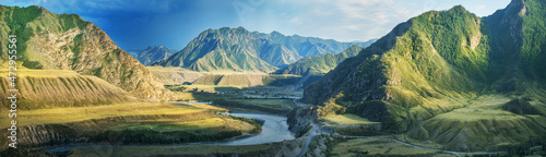 Mountain valley in contrasting evening light, large panorama, Altai