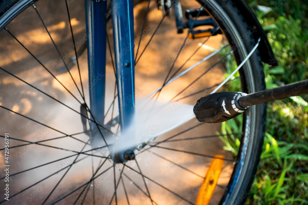 Cleaning washing a bilcycle wheels with pressure washer cleaner. Self service do it yourself maintenance Cleaning washing a bilcycle wheels with pressure washer cleaner. Self service do it yourself maintenance