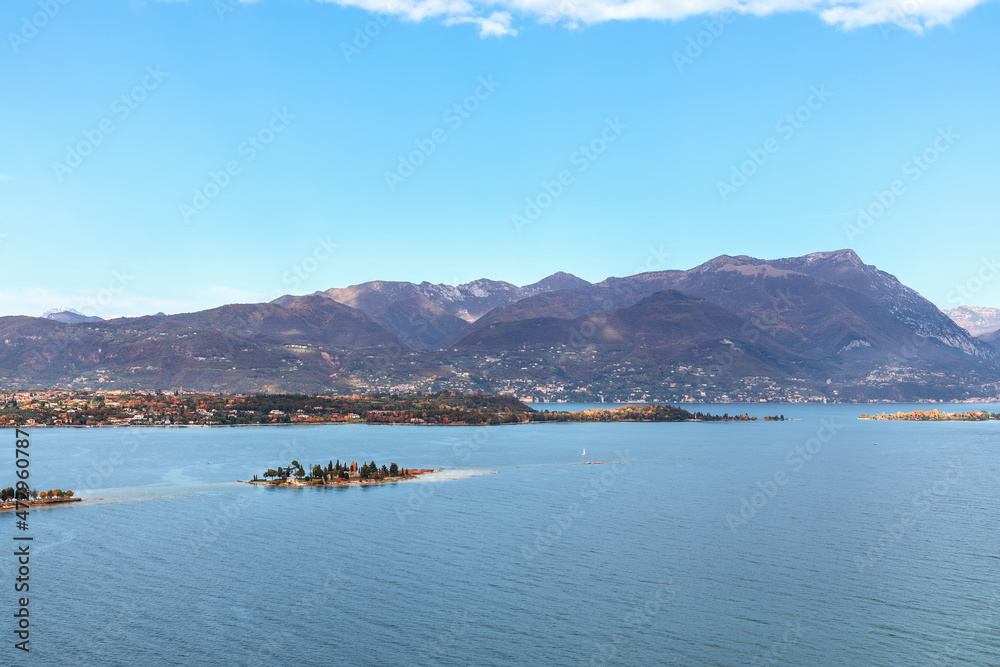 Beautiful autumn view of Lake Garda and small Rabbit Island