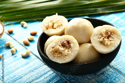 Kozhukatta - steam cooked rice balls stuffed with coconut , jaggery, dry fruits,  photo