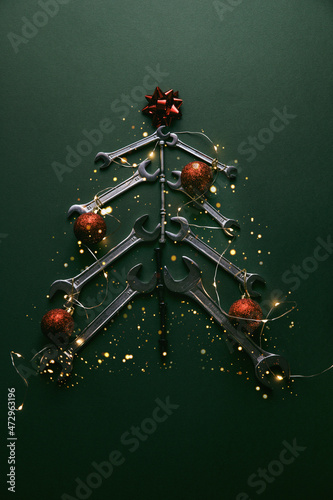 Christmas tree made of various tools on a green background. Happy christmas and happy new year. 