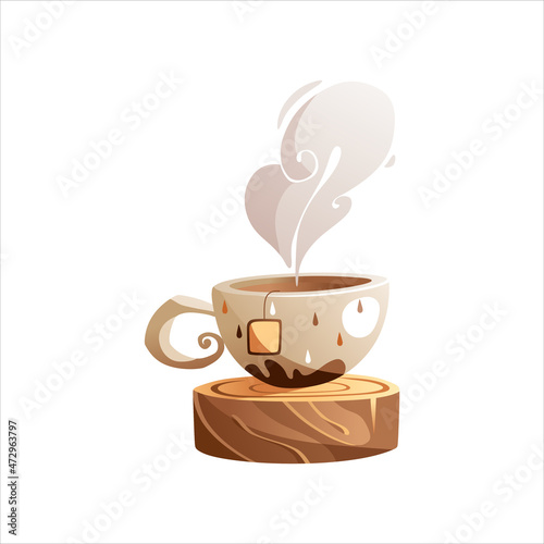 Autumn cup of hot tea standing on a wooden stand with a feather in the shape of an oak leaf.
