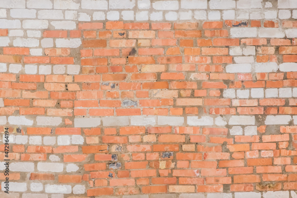 Old brick wall with red brown and white stone surface texture background