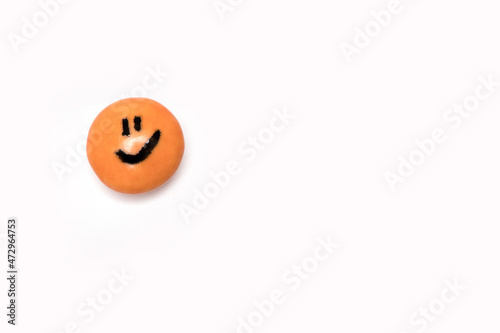 one orange smiley on a round sweet