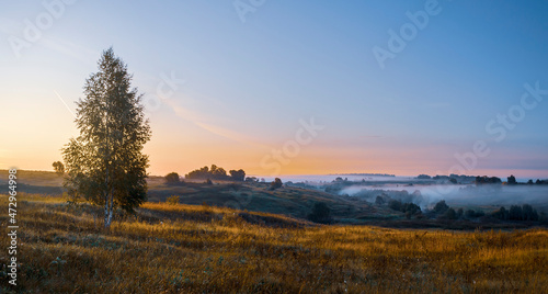 Foggy sunrise over the hills © valeriy boyarskiy