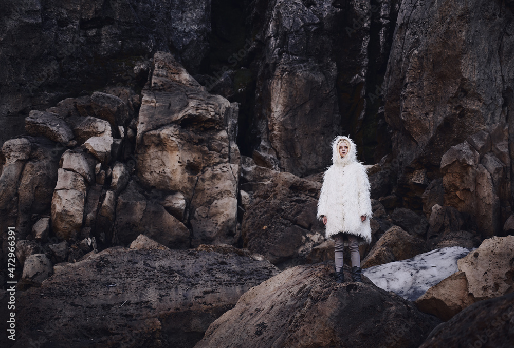Obraz premium Fashion shooting in nature, a girl model in a fur coat made of artificial fur.