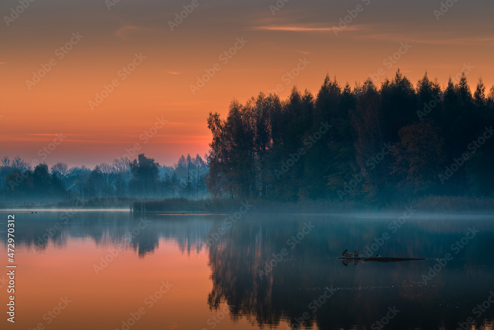 beautiful sunrise over the lake. Autumn sunrise over the Zemborzycki Reservoir. Reflections in the water.