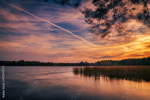 beautiful sunrise over the lake. Autumn sunrise over the Zemborzycki Reservoir. Reflections in the water.