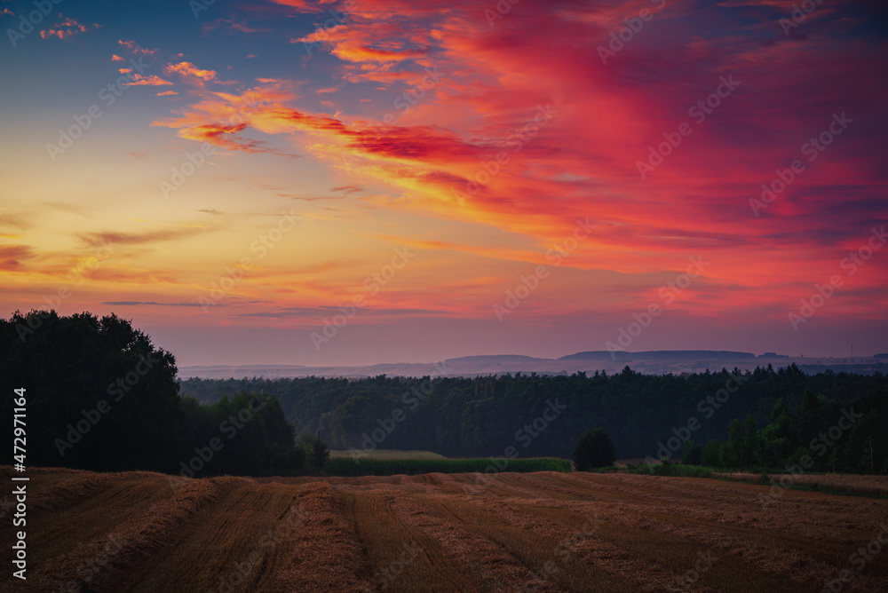 A wonderful sunset over the fields and meadows in Poland,