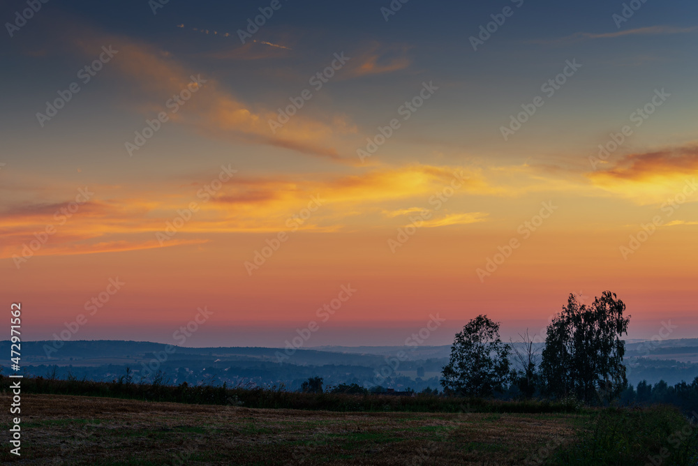 A wonderful sunset over the fields and meadows in Poland,