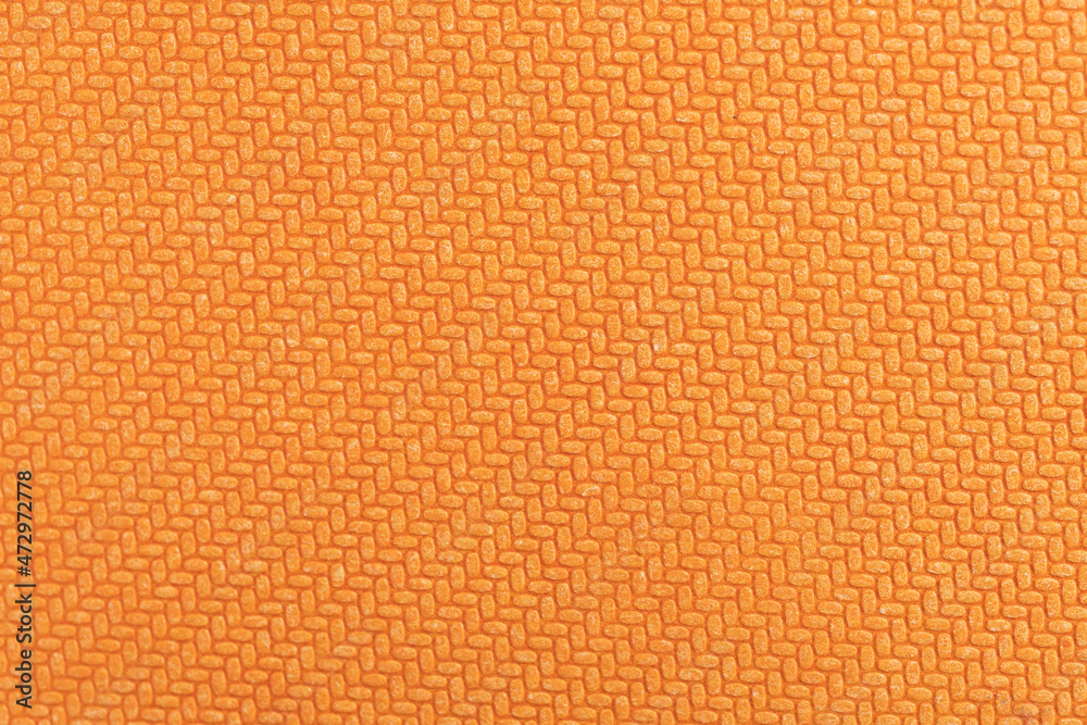 Fototapeta premium Orange geometric texture embossed on hard cardboard