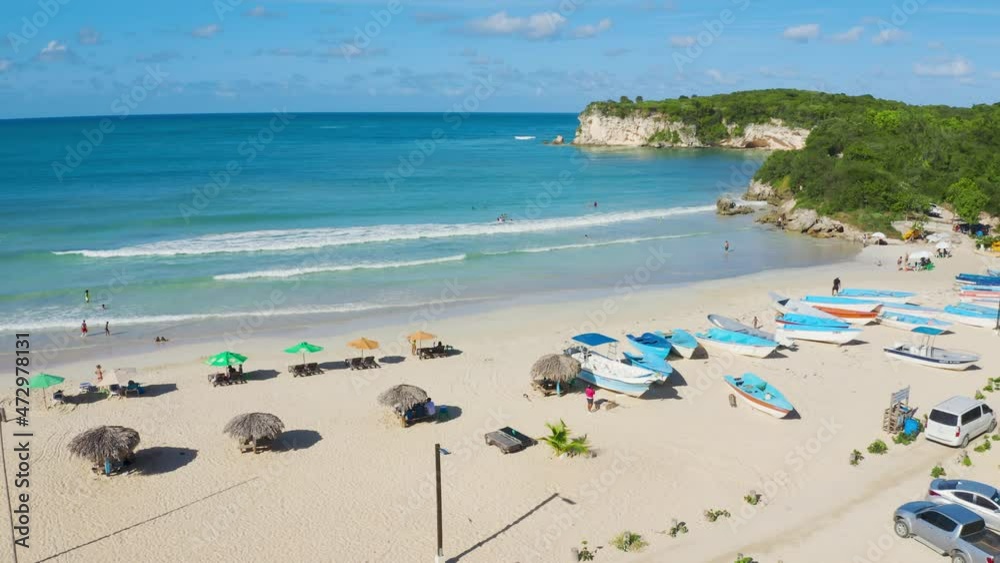 Sunny summer morning on the beautiful Macaо beach in the Dominican Republic. Bright blue sea waves off the sandy coast of a green tropical peninsula. Great vacation on an exotic palm beach. Sunny summer morning on the beautiful Macaо beach in the Dominican Republic. Bright blue sea waves off the sandy coast of a green tropical peninsula. Great vacation on an exotic palm beach.