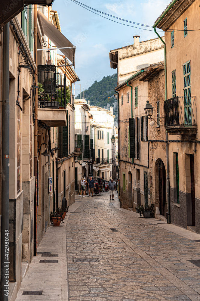 Street with old buildings clear sky and greenery on an island in Spain, Mallorca, Alcudia