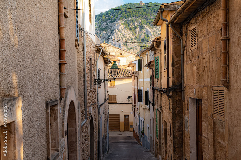 Street with old buildings clear sky and greenery on an island in Spain, Mallorca, Alcudia