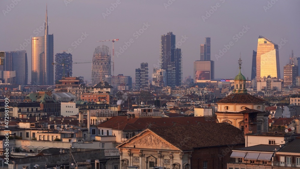 Europe , Italy , Milan December 2021 - 
aerial view of the city skyline in Gae Aulenti Garibaldi  at sunset from Duomo Terrace 
