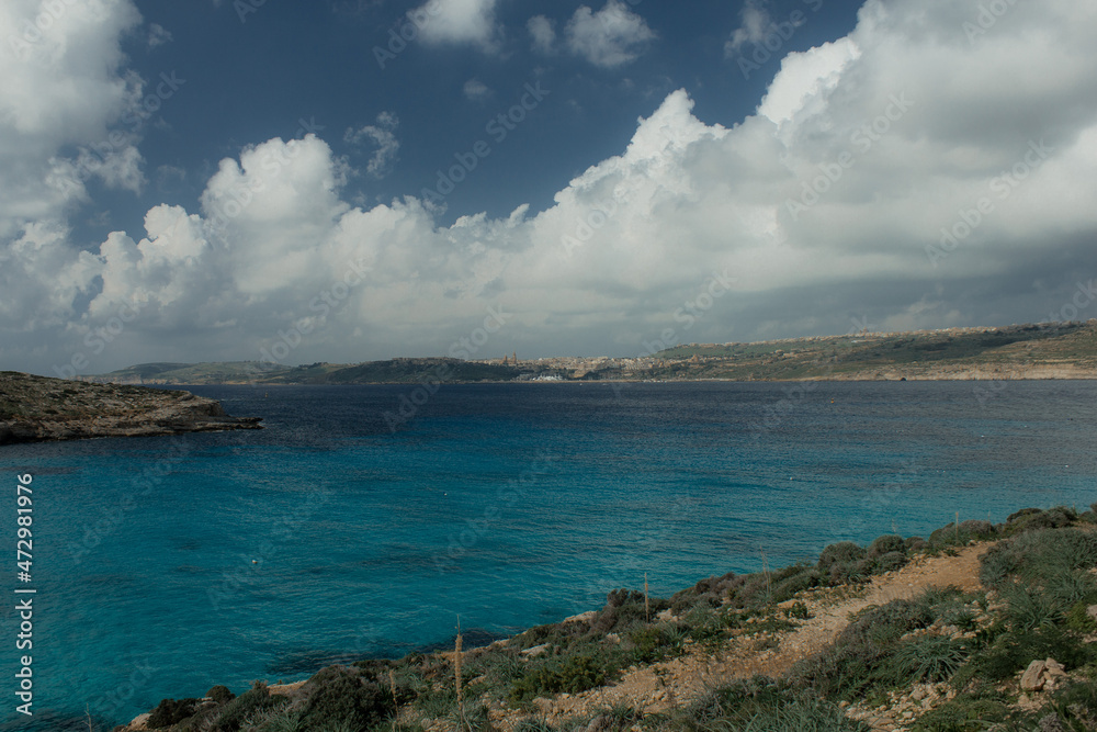 Clear water from coast with beach and clear sky