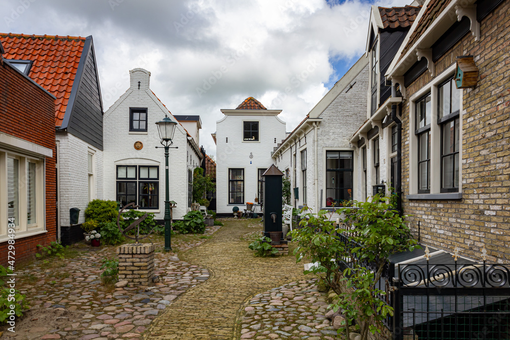 Port town with old buildings in Texel, Netherlands