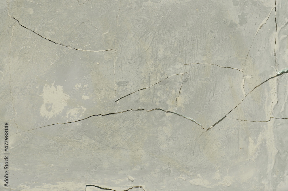 Obraz premium background. gray, cracked wall. old and worn, broken surface.