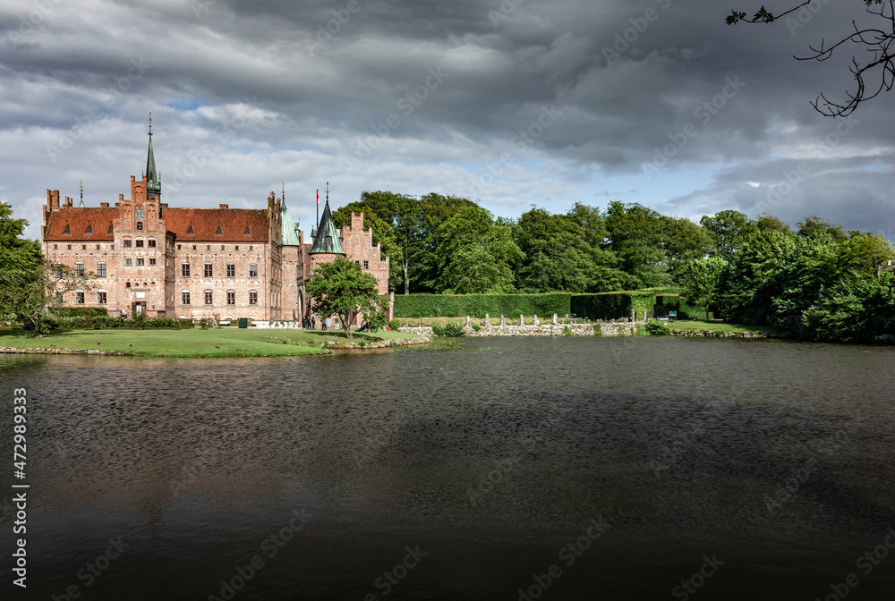 Fototapeta premium Castle estate during summer day in Egeskov Slot, Denmark