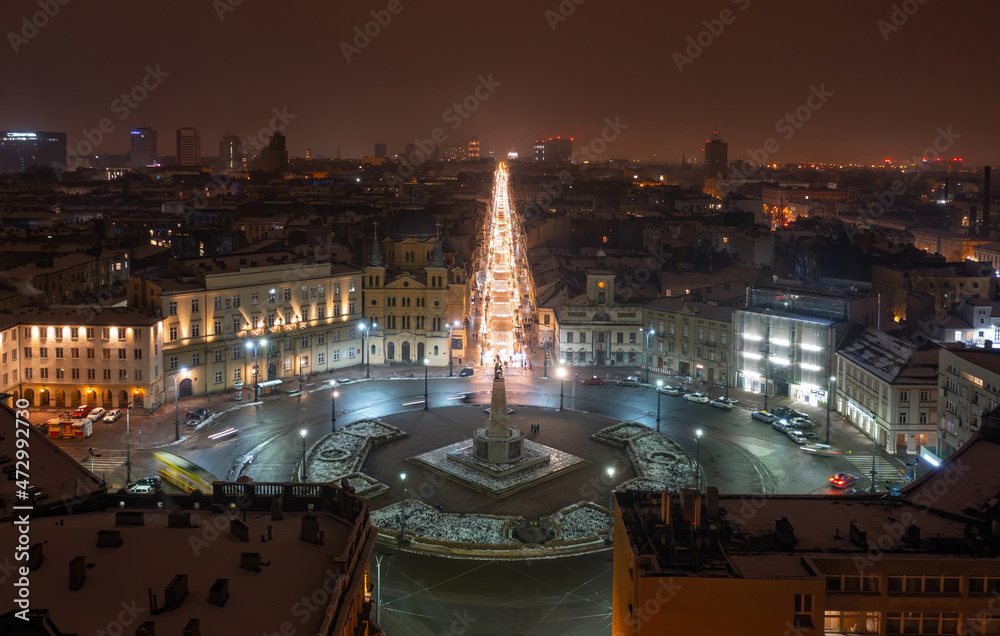 Aerial night winter view above Independence square and Piotrkowska street in Łódź, Poland