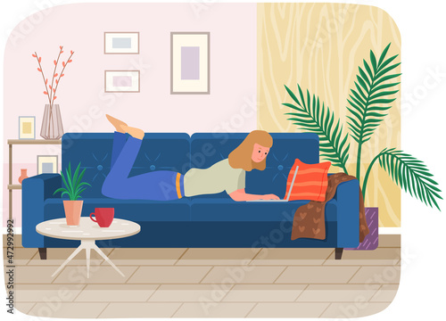 Distance learning, freelance and internet job. Woman lying with laptop on couch at home. Remote work, online home freelancing, entertainment. Online communication, internet surfing in living room