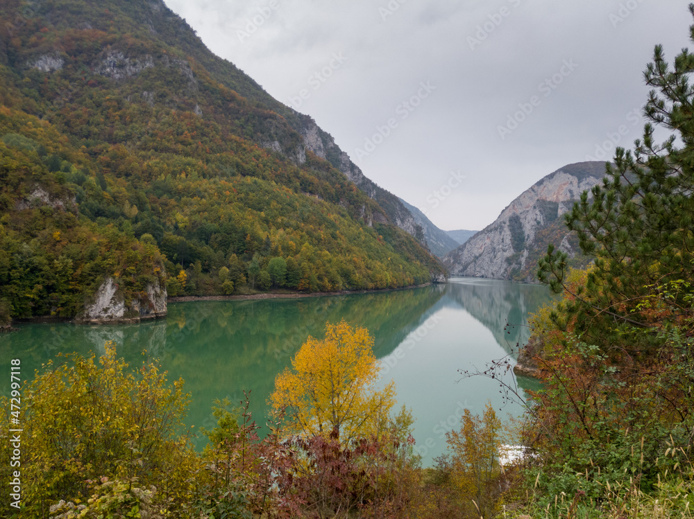 The canyon of the river Drina in autumn colors on the vegetation during a cloudy day The canyon of the river Drina in autumn colors on the vegetation during a cloudy day