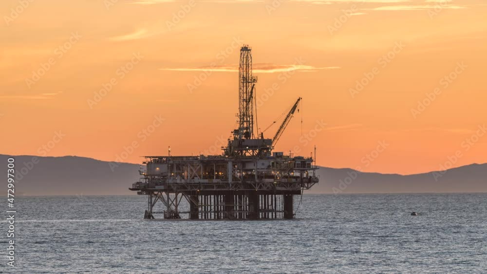 An oil platform off the coast of California lights up as the sun sets. Notice the interesting natural heat haze as it periodically distorts the platform until evening arrives and the weather cools.
An oil platform off the coast of California lights up as the sun sets. Notice the interesting natural heat haze as it periodically distorts the platform until evening arrives and the weather cools.