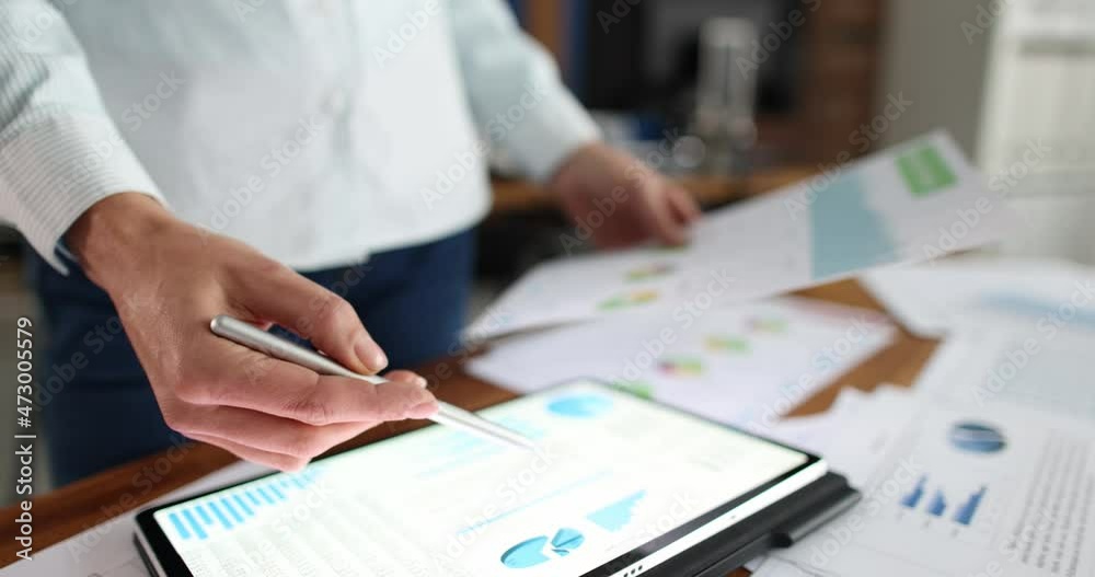 Businesswoman examines business charts at workplace slow motion 4k movie Businesswoman examines business charts at workplace slow motion 4k movie