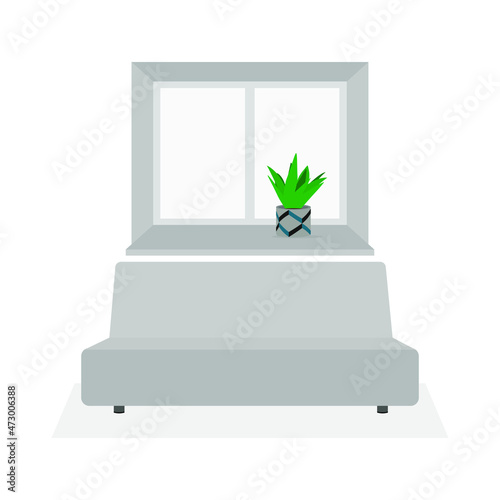 Sofa and window with a plant in a pot on the windowsill