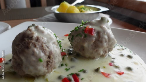 Meatballs with white sauce Koenigsberger Klopse traditional German dish photo