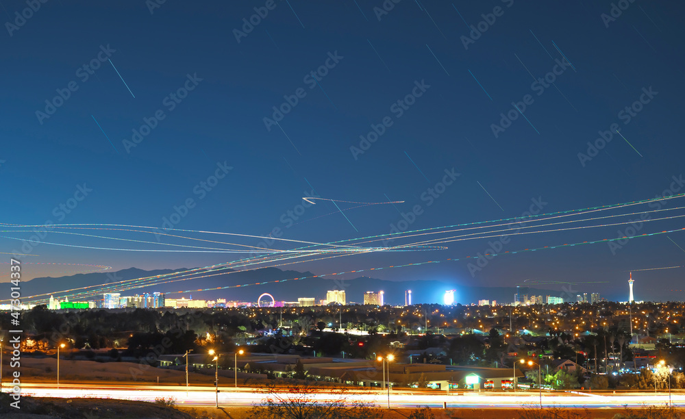 Las Vegas skyline with land and air traffic at dusk