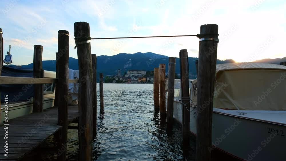 Beautiful View of San Giulio island within Lake Orta on a lovely summer evening Beautiful View of San Giulio island within Lake Orta on a lovely summer evening