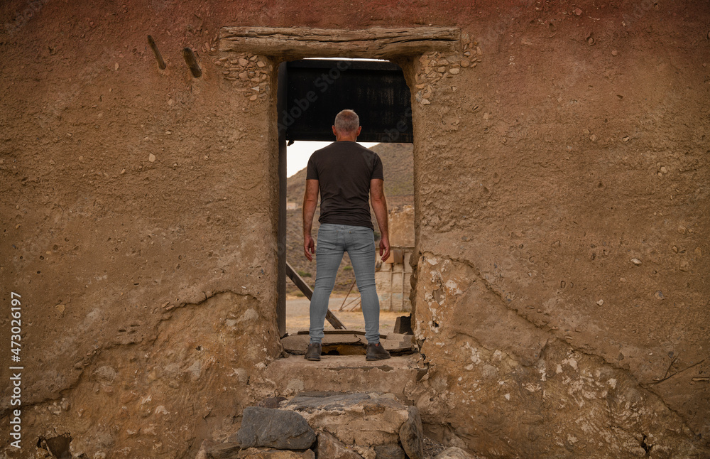 Adult man in film set in Tabernas desert, Almeria, Spain
