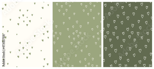 Cute hand drawn vector patterns with tiny green and beige hearts. 