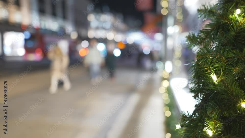 A street view of a night street at Christmas time.