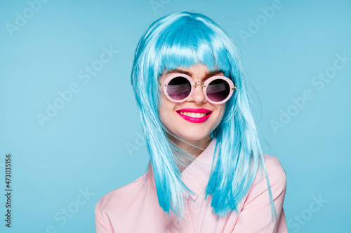 Glamorous woman blue wig makeup fashion posing