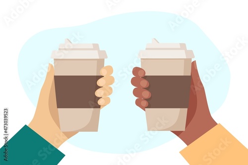 Black hand and white hand hold cups of hot drink. Disposable coffee paper cup