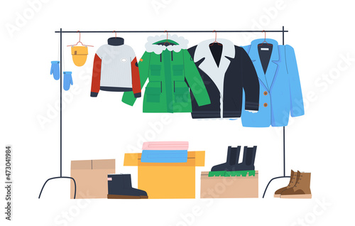 Rack with winter clothes on hangers. Boxes and winter shoes. Clothing store or donation. Flat vector illustration